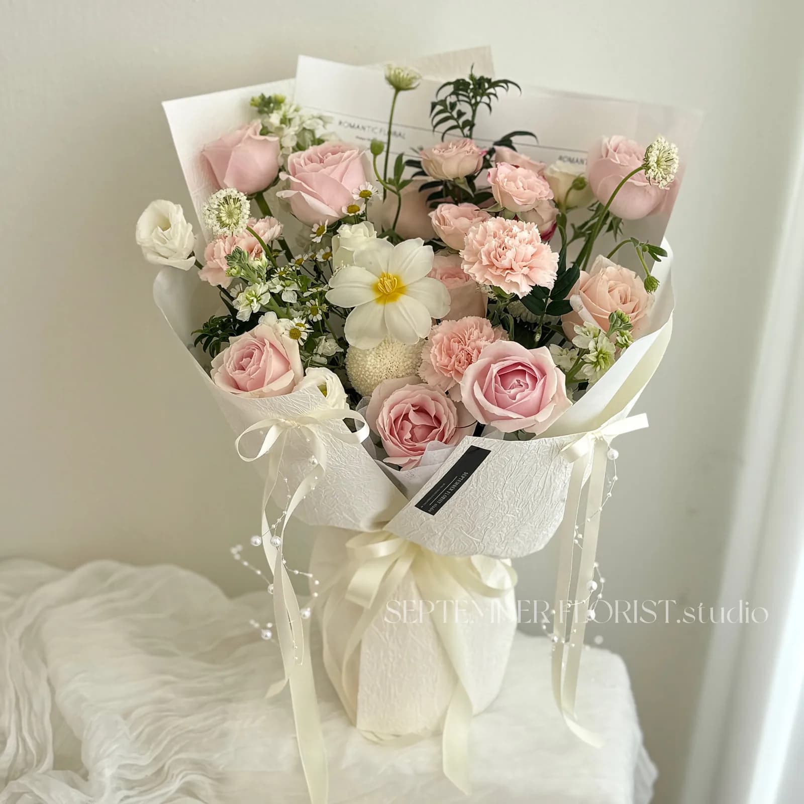 A blush and ivory bouquet from September Florist Studio