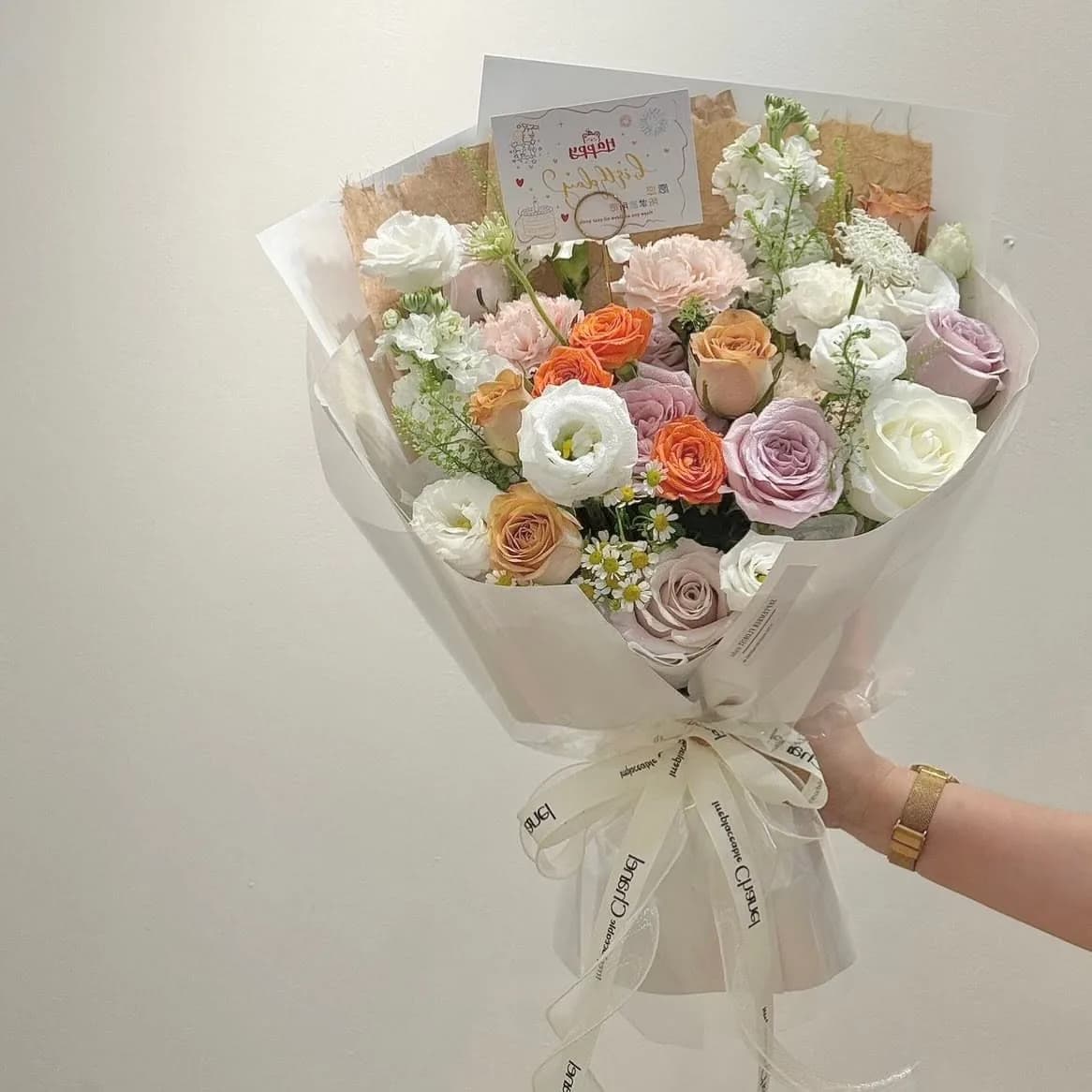 Sunlit Market — Roses, lisianthus, ranunculus in coral and mauve